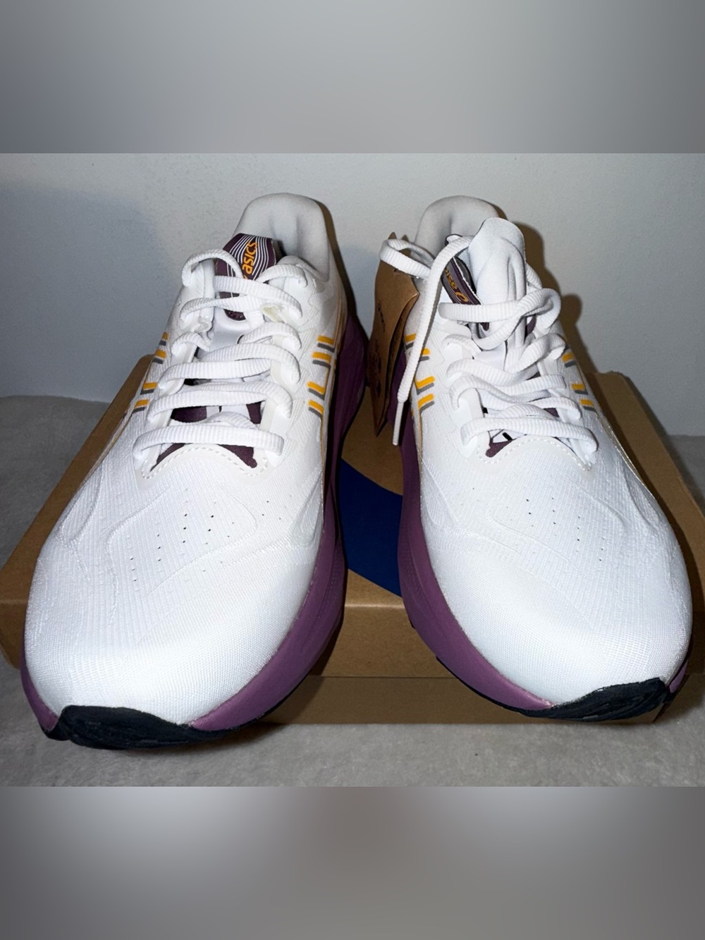 ASICS White Athletic Shoes with Purple Soles and Yellow Stripes - Picture 2 of 5